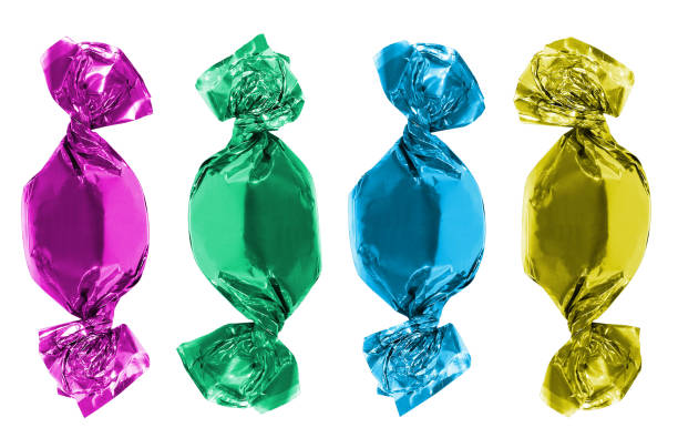 istock A set or collection of sweets in multi-colored foil packaging on an isolated white background. Candies in purple, blue, green and yellow wrappers. 1412005504