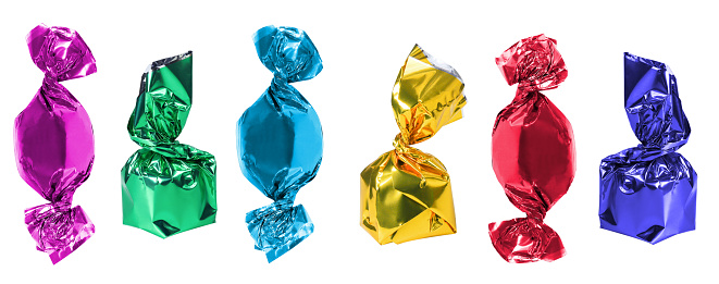 Candies in purple, red, blue, green and yellow wrappers.