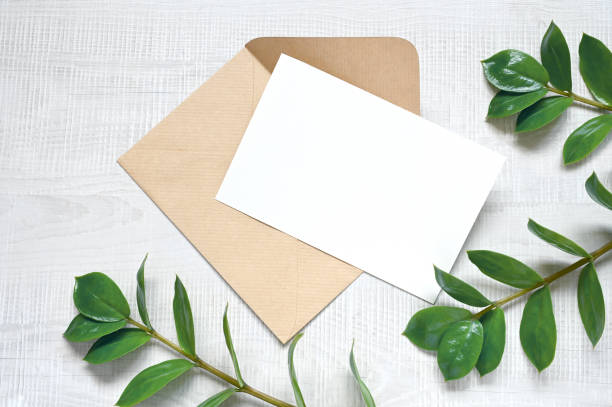 istock Mock up card with plants. Invitation card with envelope on white background. 1412006803