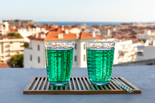Diabolo mint, french non-alcoholic cold drink on the summer city background
