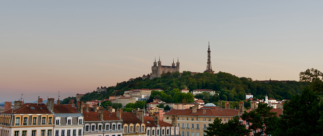 Panoramic photo of the Fourvière hill with the basilica Our Lady of Fourvière standing out at the end of the day.