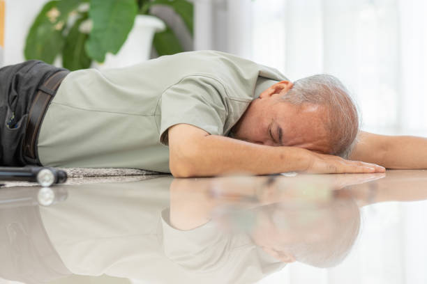 istock Senior Asian man falling down from chair unconsciousness alone at home. Accident in elderly man down on the floor lose consciousness or hearth attack. Elderly symptom and sudden pain. Elder care 1412008964