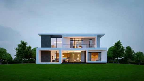 Photo of Modern house exterior evening view with interior lighting.3d rendering