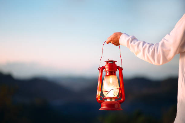 Holding a kerosene lamp
