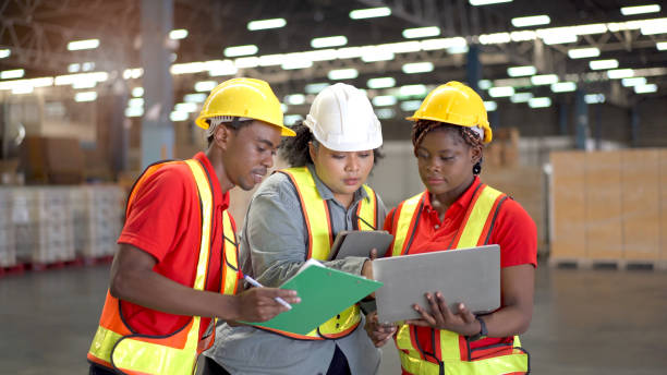 istock Group of foreman or engineer working in the warehouse. 1412012126