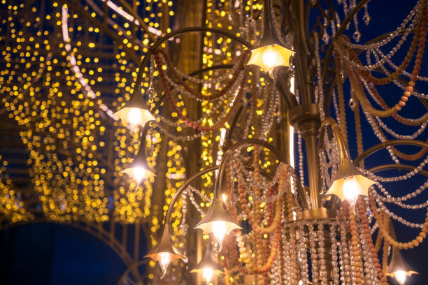 istock Hanging golden lamp with glitter pearl decorated with light bokeh 1412012277