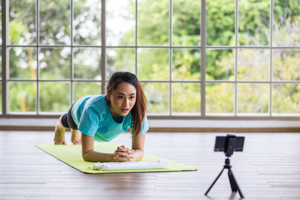 istock live streaming of planking exercise video content for her online class 1412012286