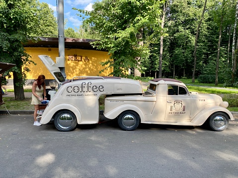 Moscow, Russia - July 31, 2022: Antique car is used as coffee take out shop