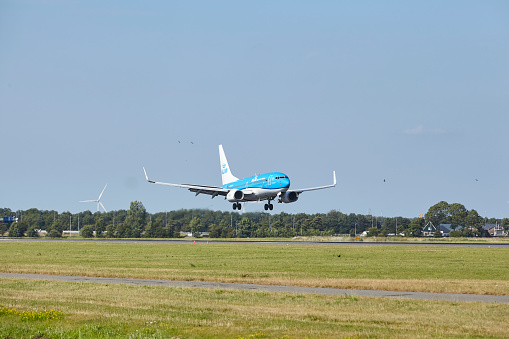 Amsterdam, The Netherlands - July, 24, 2022. The Boeing 737-7K2 of KLM Cityhopper with the identification PH-BGH lands at Amsterdam Airport Schiphol (The Netherlands, AMS, runway Polderbaan) on July 24, 2022.