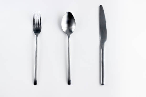 istock Silver fork, spoon, knife isolated on white. 1412017225