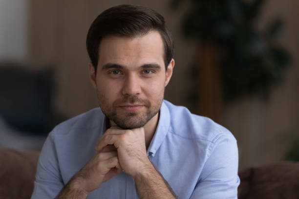 istock Head shot portrait confident handsome man looking at camera 1412021255