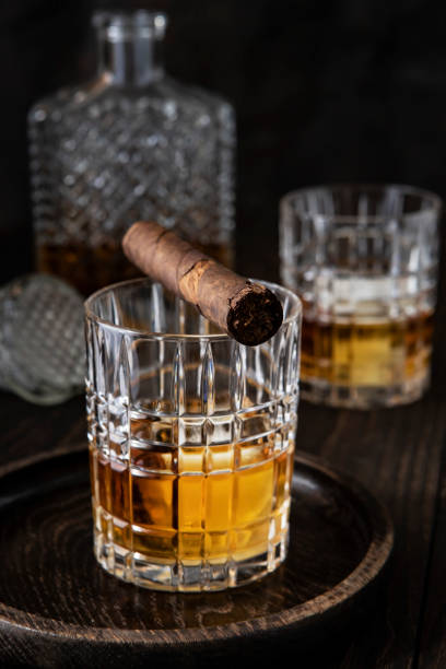 istock Glasses of  whiskey on dark background 1412021766