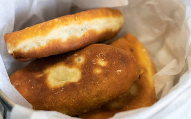 Appetizing savory fried pies. Traditional fresh, freshly made homemade stuffed pies, also known as pastel. Rustic fried yeast dough pies.