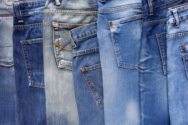 istock Heap of torn jeans denim background texture. Blue jeans fabric material surface 1412023363