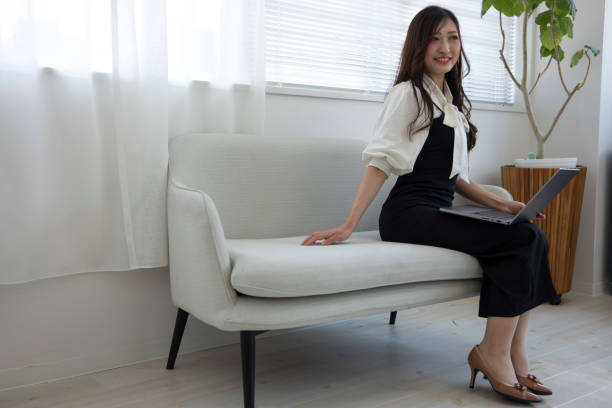 istock A Japanese woman checking smartphone by remote work in the home office 1412028533