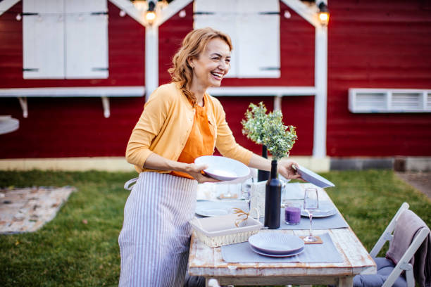 istock Woman serving outdoor party table 1412028605