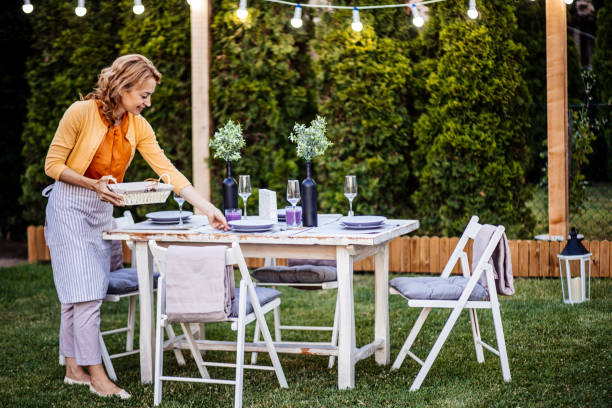 istock Woman serving outdoor party table 1412028628