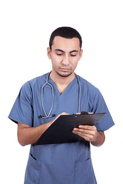 istock young doctor typing on clipboard 141203055