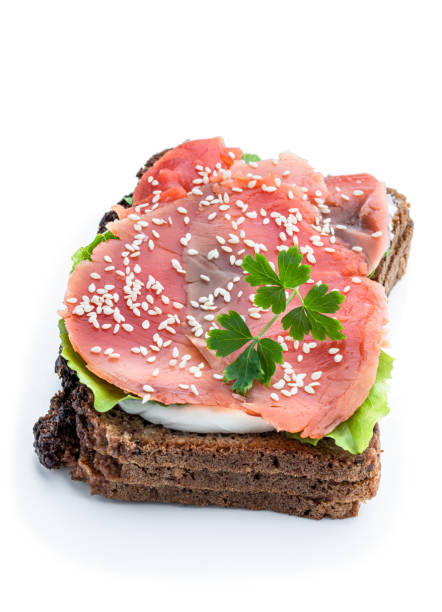 Healthy  toast with rye bread and salmon isolated on white