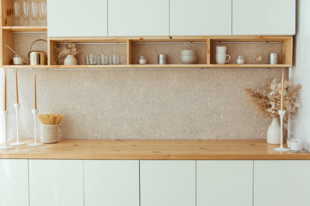 istock Kitchen shelves with various white ceramic, glass jars. Open shelves in the kitchen. Kitchen interior open shelving ideas. Eco friendly kitchen, zero waste home concept 1412033998