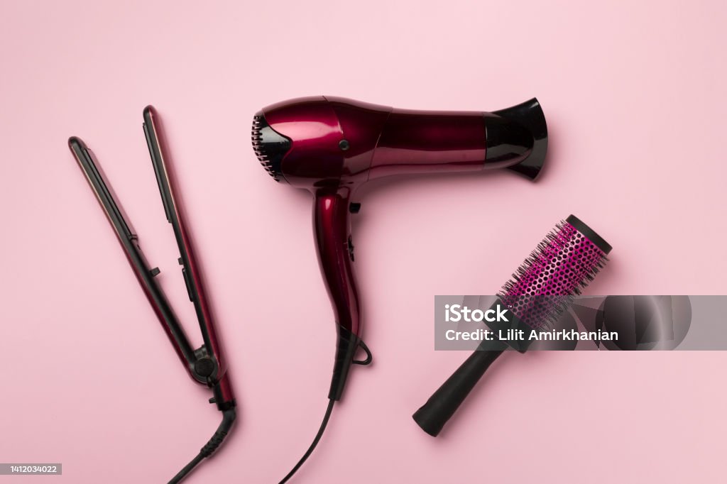 Hair Dryer Straightener And Brush On Color Background Top View Stock Photo  - Download Image Now - iStock