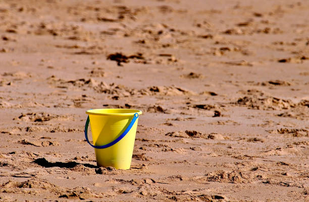 Colorful plastic toys on the beach