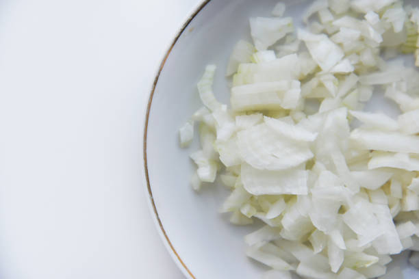 istock White onion cut into strips on a saucer 1412034345