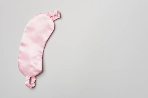 istock Sleeping eye mask on color background, top view 1412034442