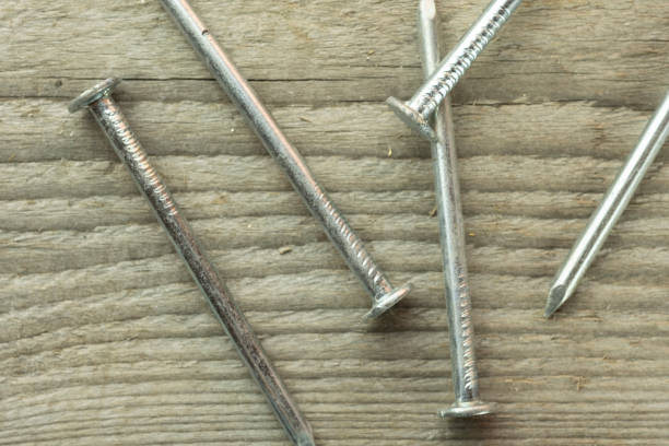 istock Nails are scattered on the plywood surface floor at the construction site 1412035021