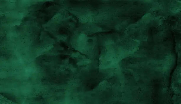 Photo of Dark green watercolor. Emerald green color. Art background with space for design.