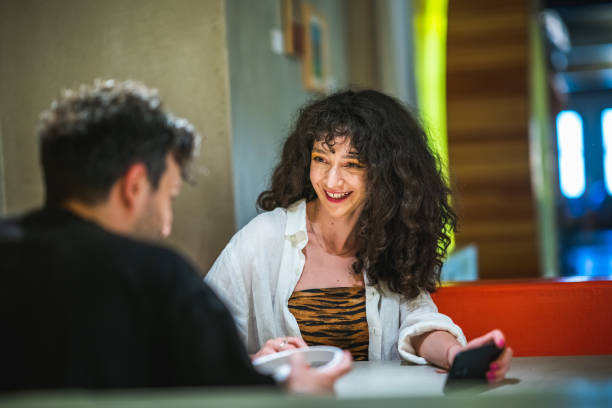 istock Young couple having fun in a cafe 1412036595