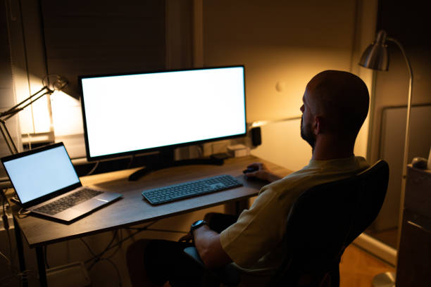 istock Male trader working late night at home. 1412036670