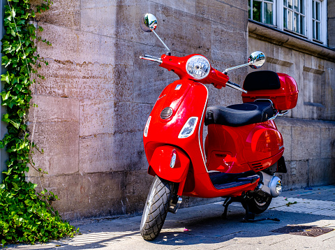 Siena, Italy - June 21:typical italian Vespa Motorscooter (build from Piaggio) at a street in Siena on June 21, 2022