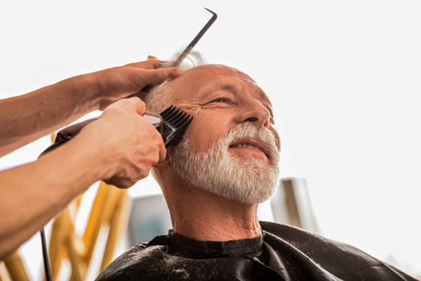 istock Man getting beard trimmed in barber shop 1412037194