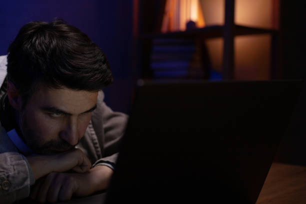 istock Man looking at laptop computer workplace. Businessman working home 1412040657