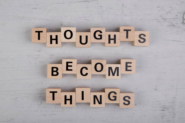 istock wooden cubes showing the words thoughts become things 1412042085