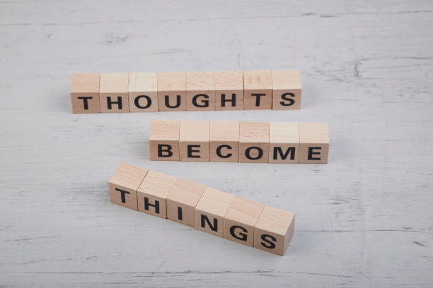 istock wooden cubes showing the words thoughts become things 1412042137