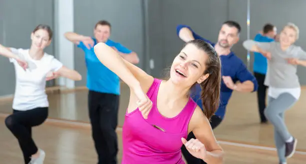 Photo of Woman training at group dance class