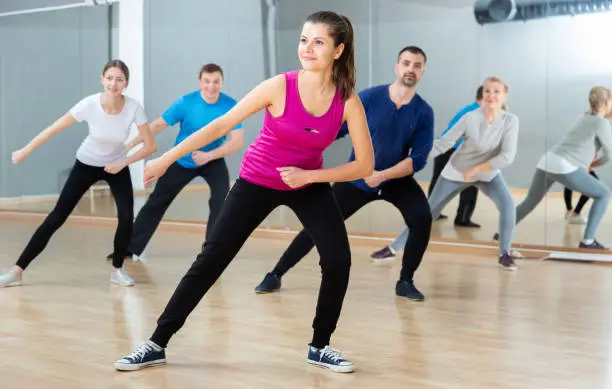 Photo of Woman training at group dance class