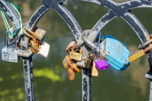 A rusty lock love with a red heart