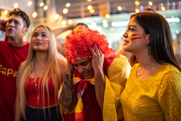 istock Spanish fan friends watching sports match at a bar 1412050607