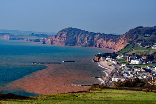 A view of Sidmouth in Devon from high on the cliffs to the East of the town, taken from the peak on the South West coastal path.