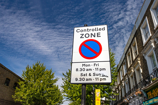 Controlled Zone Road Sign in Borough of Camden, London with someone's name scrawled across it.