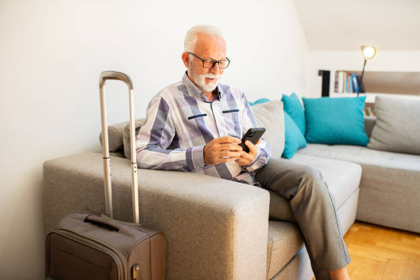 istock An elderly man is preparing for a trip 1412053126