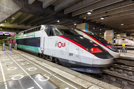 Paris, France - June 6, 2022: TGV high-speed trains of SNCF at Gare Montparnasse railway station in Paris, France.
