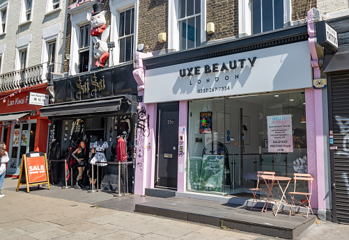Luxe Beauty Salon on Chalk Farm Road in Chalk Farm, London, with people in the background.