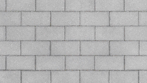 istock Grey brick wall background close up. Gray stone tile block background with horizontal texture of gray brick 1412058038