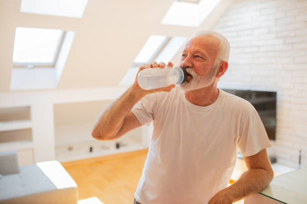 istock Senior man training at home 1412061389