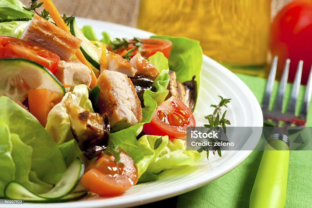 Chicken Salad Closeup of a healthy chicken salad with greens, tomatos and cucumber Barbecue - Meal Stock Photo