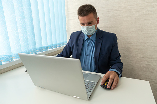 Reduce the spread of Coronavirus disease COVID-19 in the office. Ways to prevent the transmission of disease can be done by wearing a surgical mask.